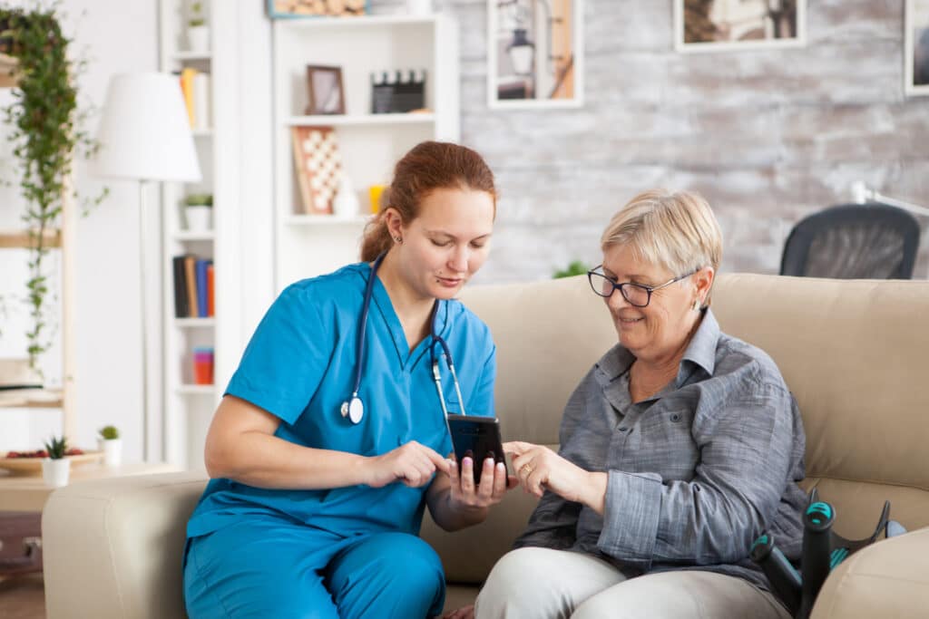 Healthcare professional using mobile technology to access patient data