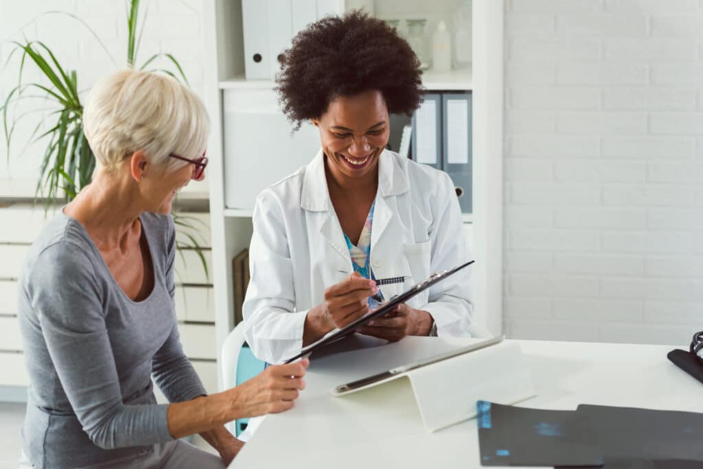 Doctor using HIPAA-compliant communication tool with patient