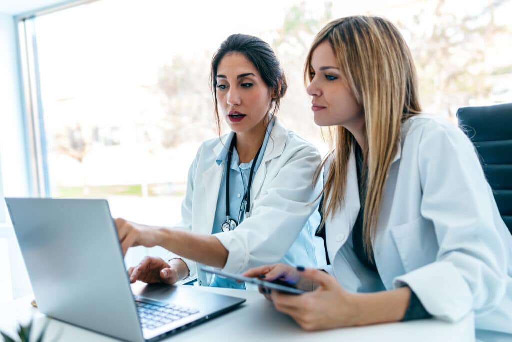 Healthcare team discussing EHR selection criteria.