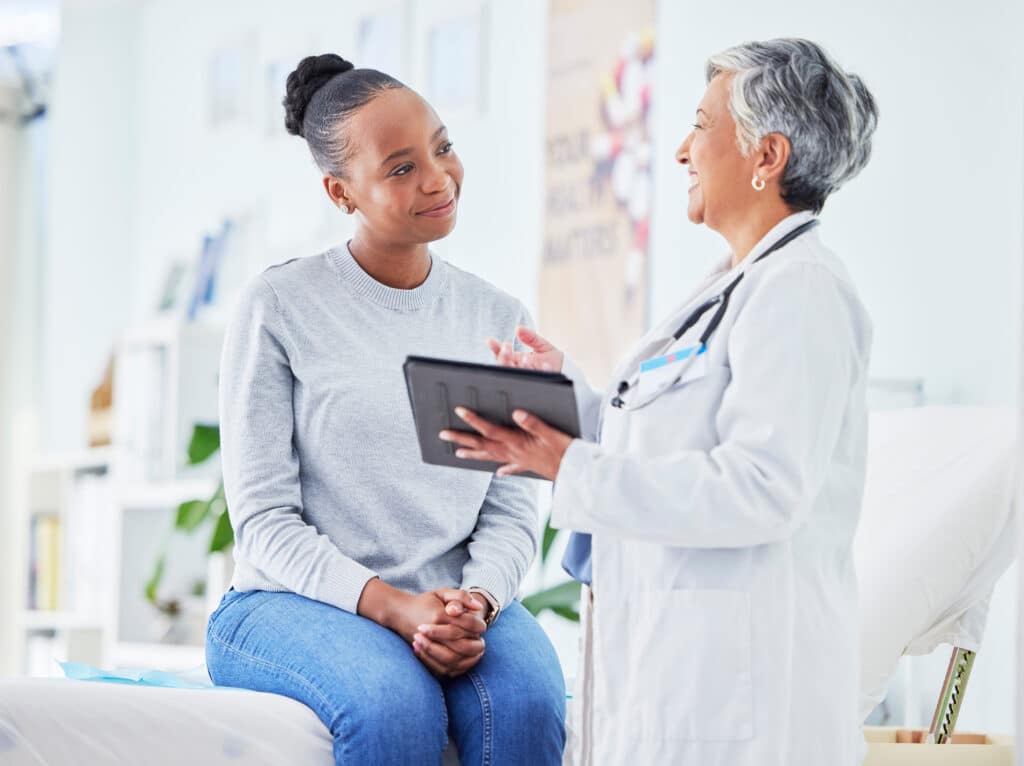 Doctor communicating with patients using digital engagement tools