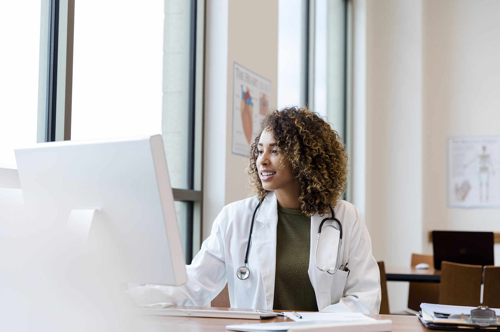 Doctor working at a computer in a medical office