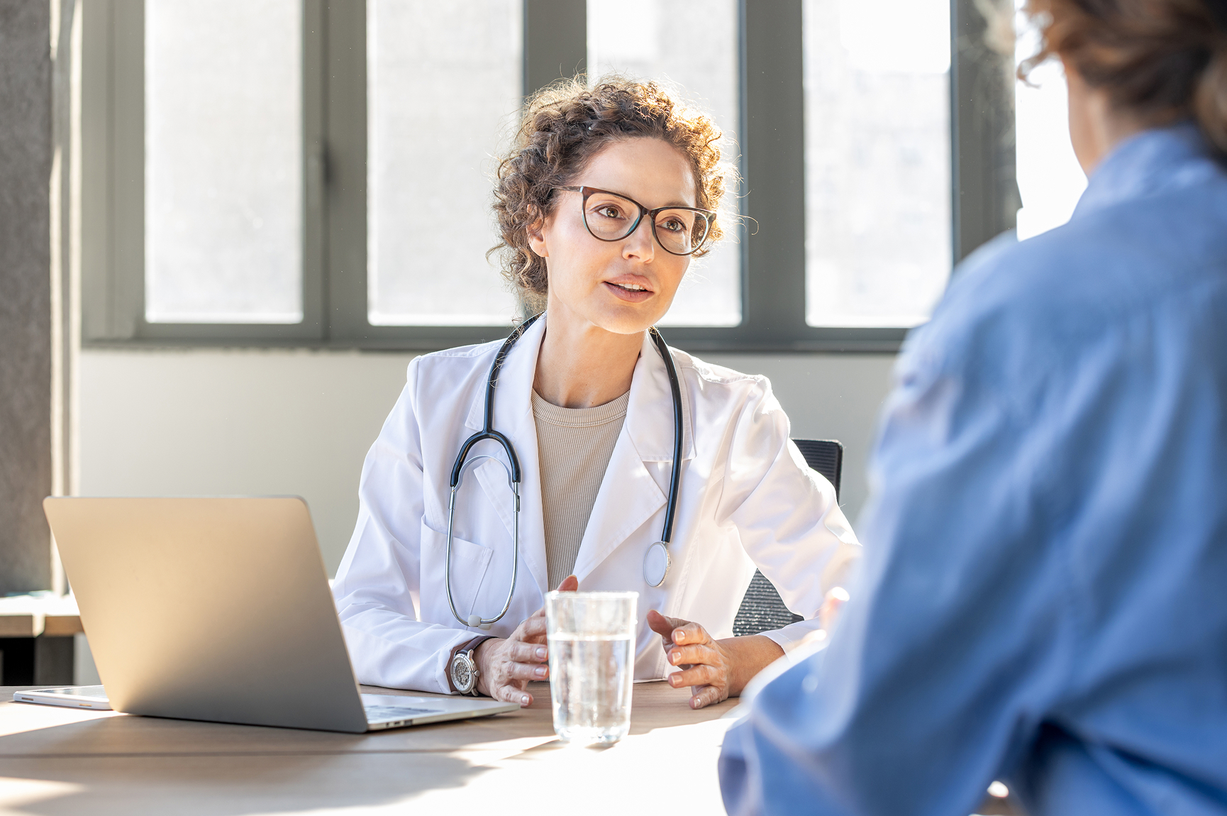 Doctor speaking with a patient during an office visit